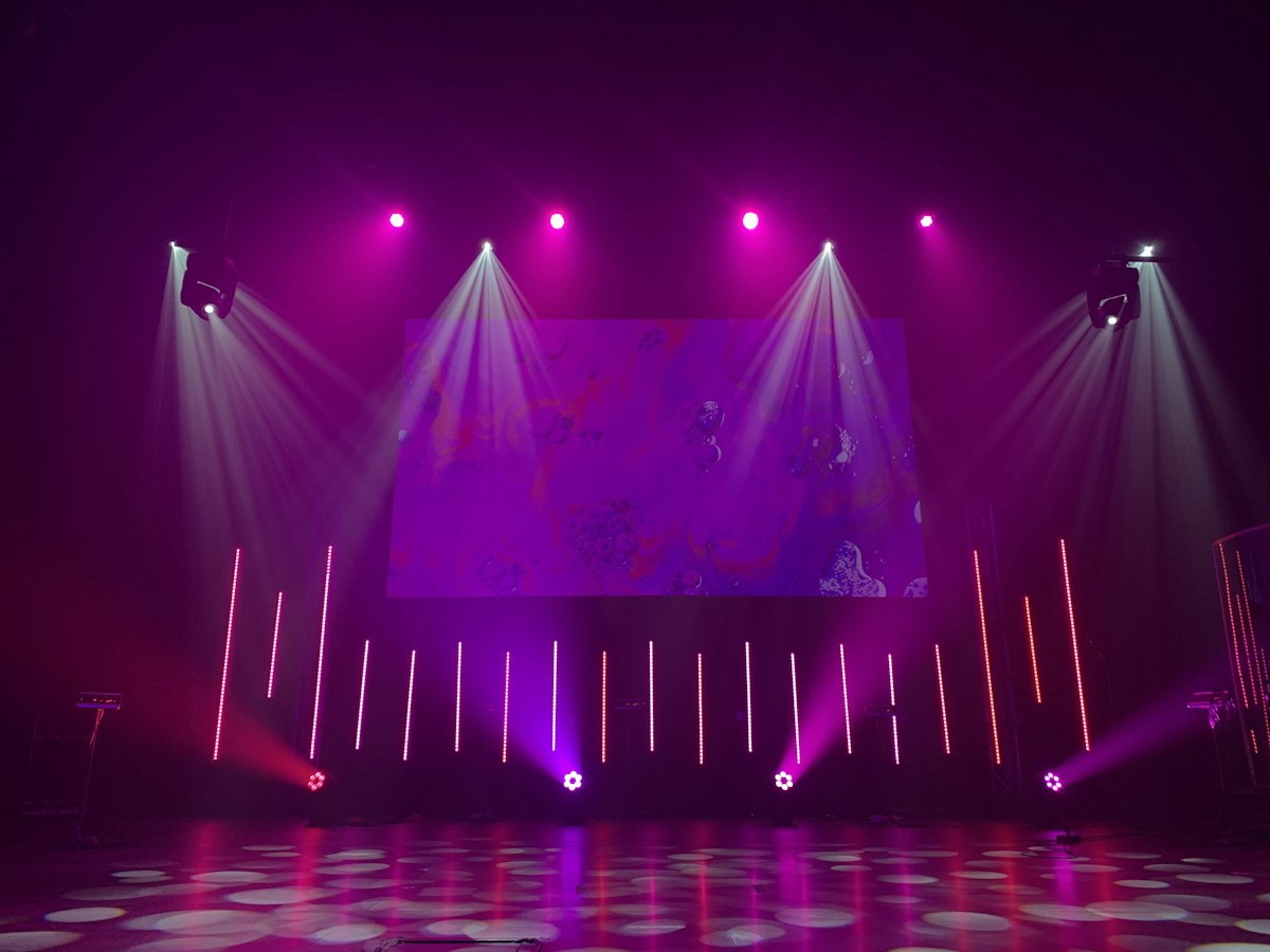 Corporate event stage with professional lighting Corporate event stage with professional lighting