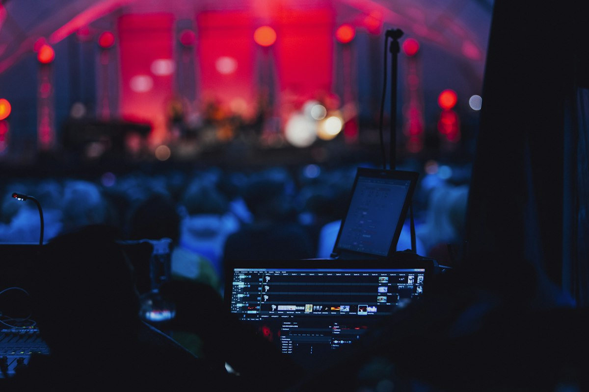 Stage with laptop and microphone set up for a technical rehearsal Stage with laptop and microphone set up for a technical rehearsal