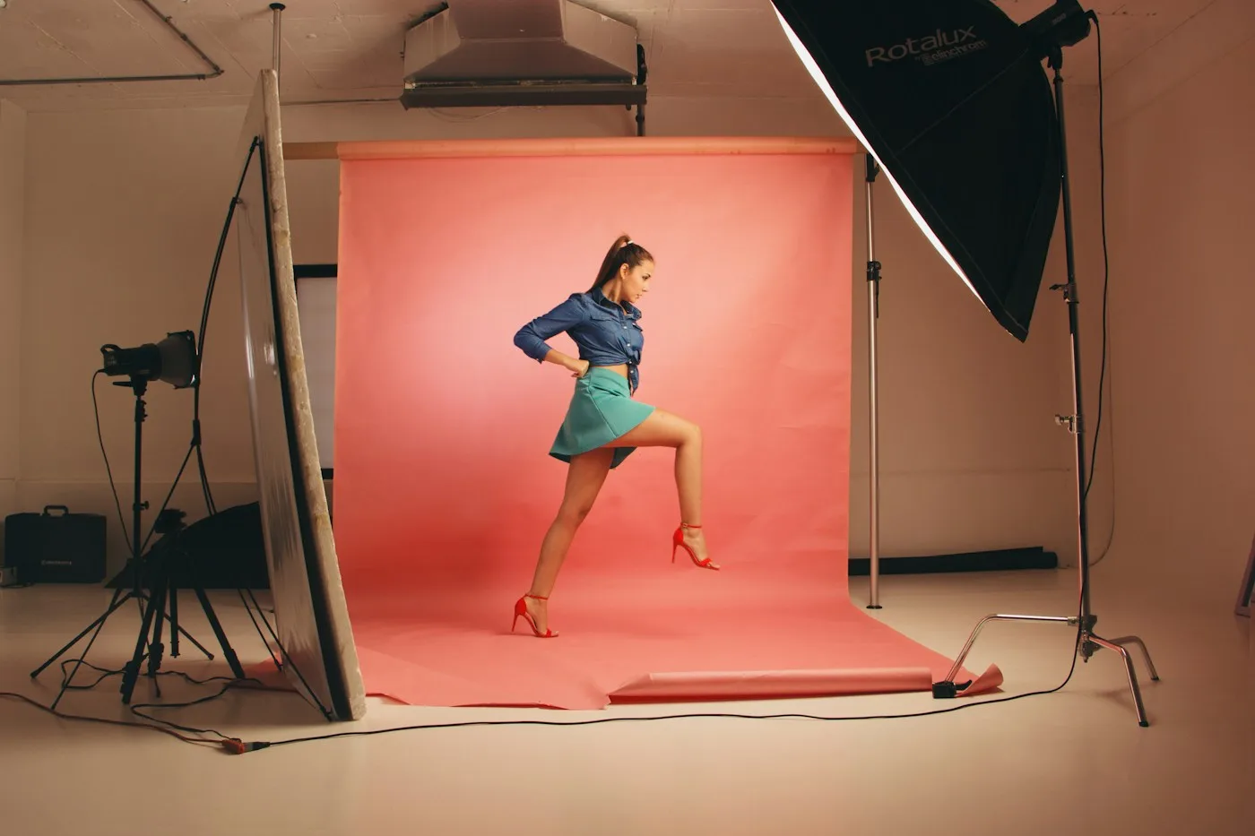 Model posing for a fashion lookbook in a studio Model posing for a fashion lookbook in a studio
