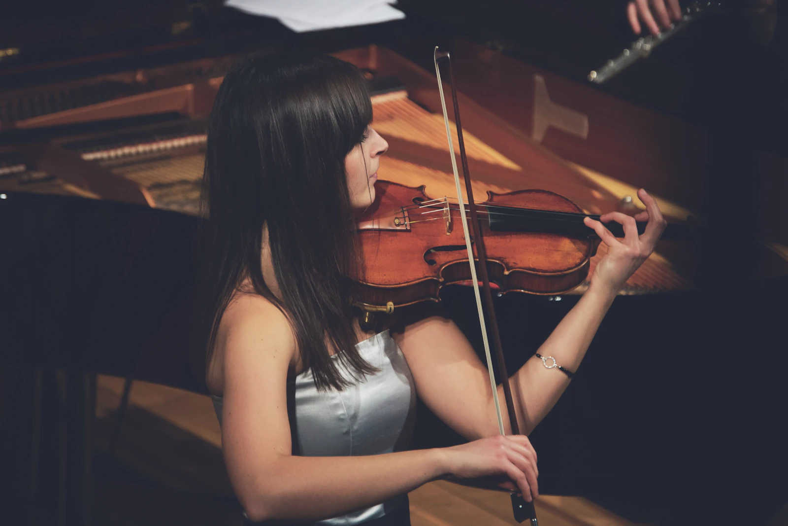 Violinist performing live music to welcome guests at a corporate event