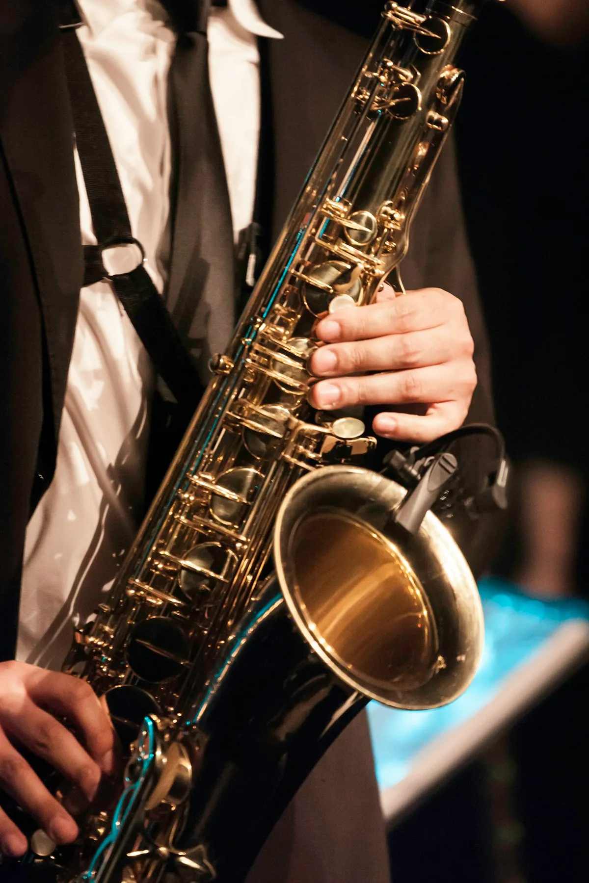 Jazz saxophonist performing live music at a cocktail reception