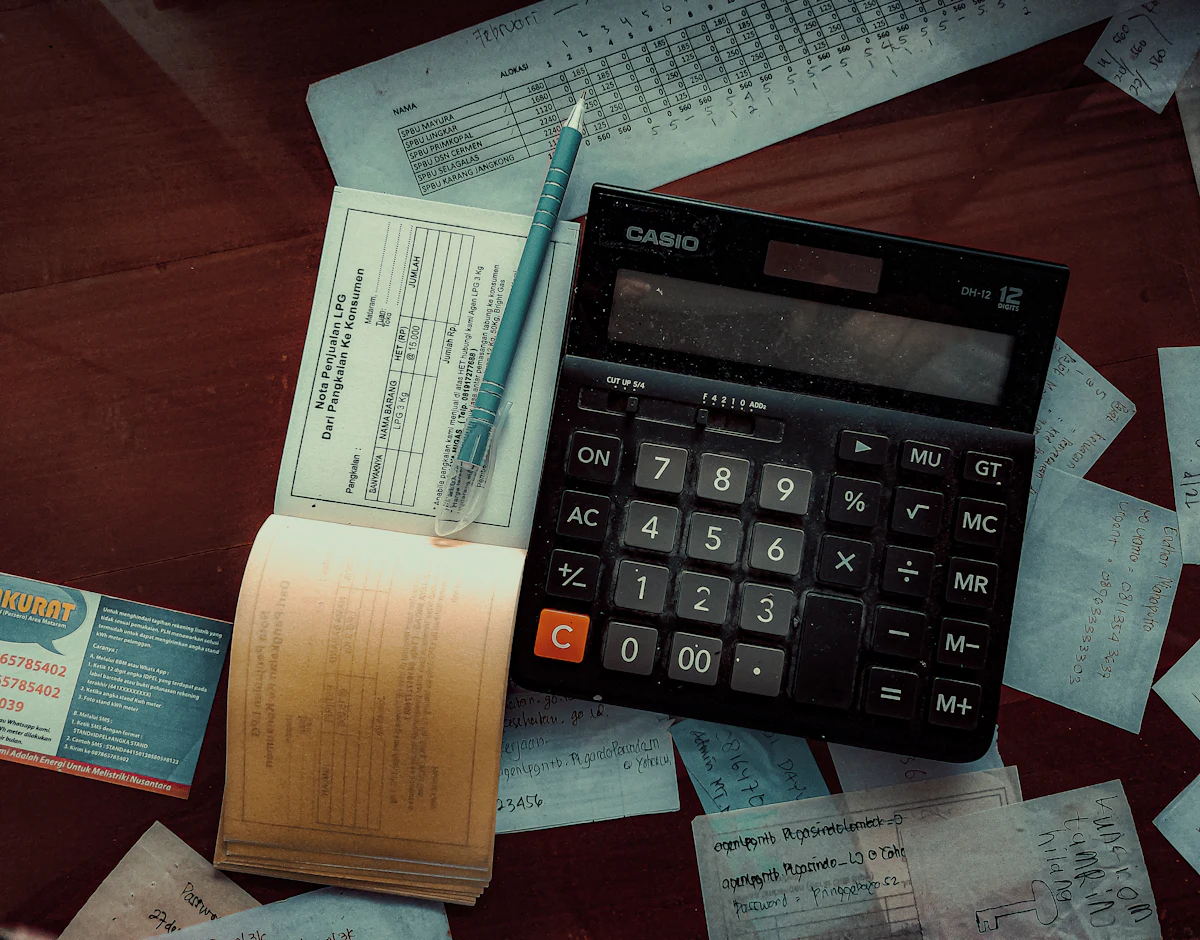 Calculator and receipts used to check an event cost breakdown Calculator and receipts used to check an event cost breakdown
