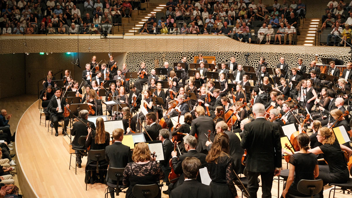 Conductor and orchestra performing in a concert hall