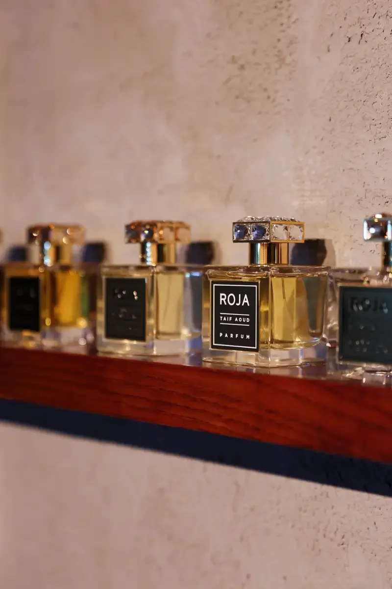 Perfume bottles arranged on a table for guest sampling at a fragrance launch