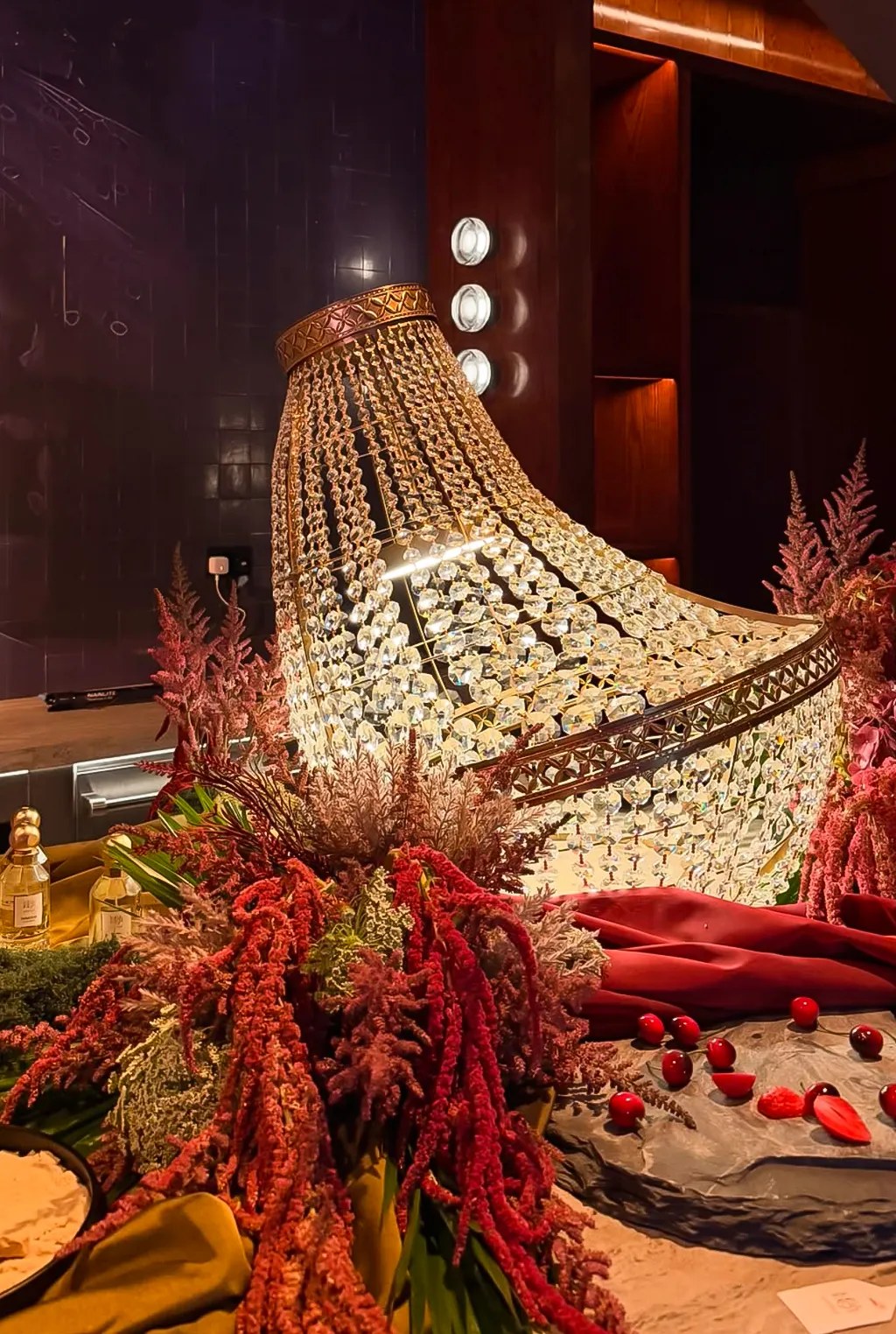 Chandelier installation with florals at Someone’s House Dubai