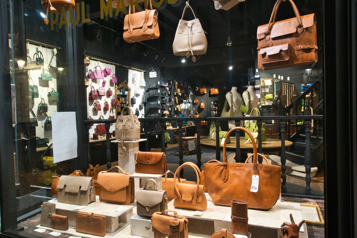 Luxury leather handbags displayed in a boutique window