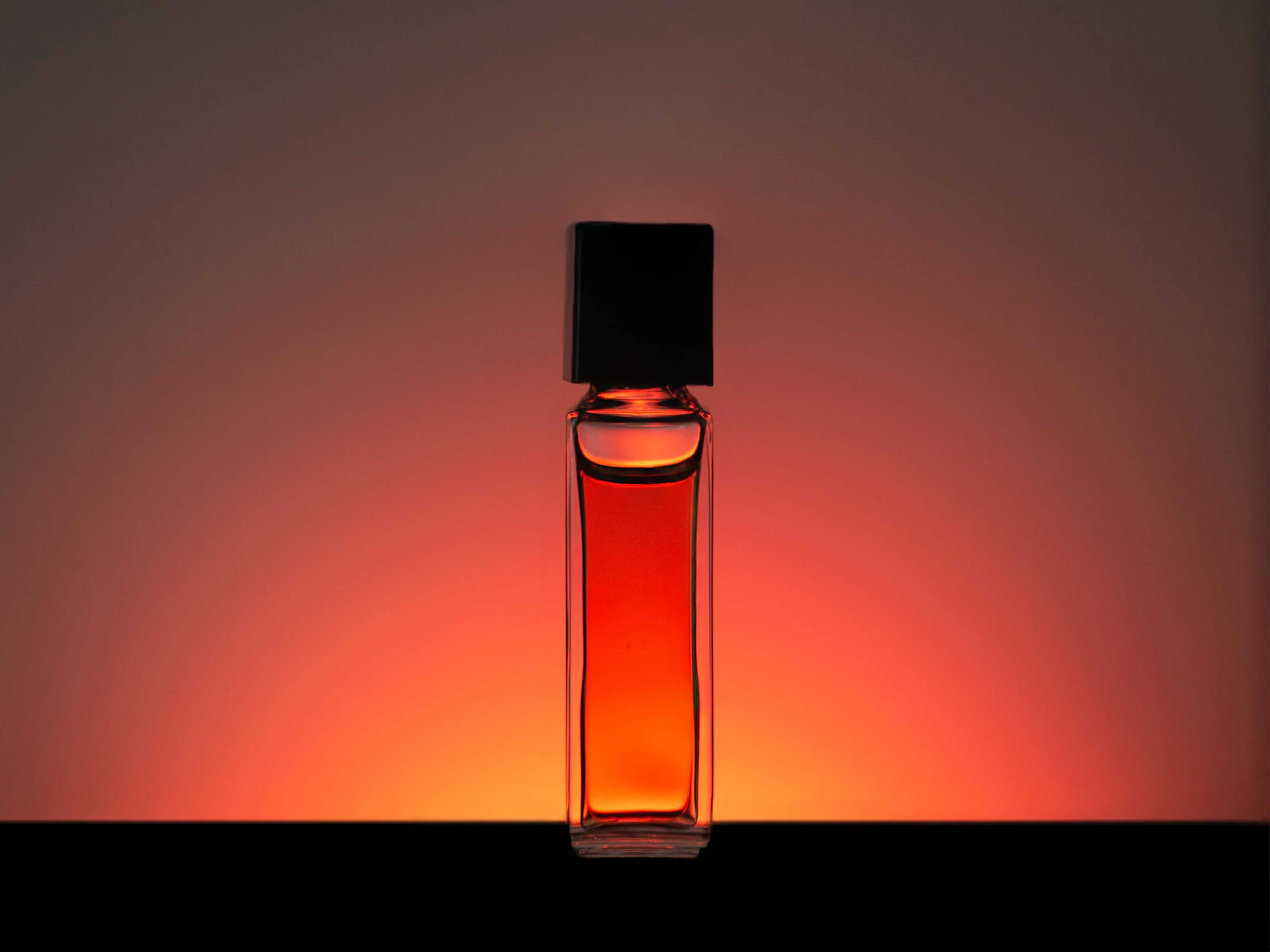 Backlit glass bottle showing how studio lighting defines shape and edges Backlit glass bottle showing how studio lighting defines shape and edges
