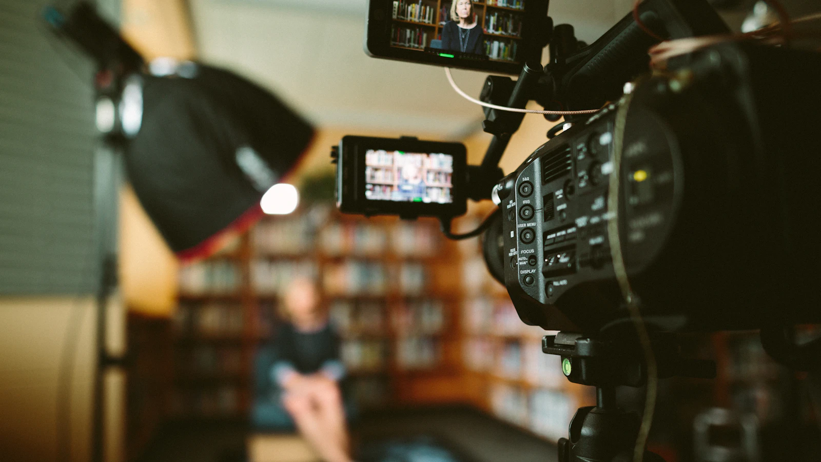 Camera recording a client interview during commercial video production
