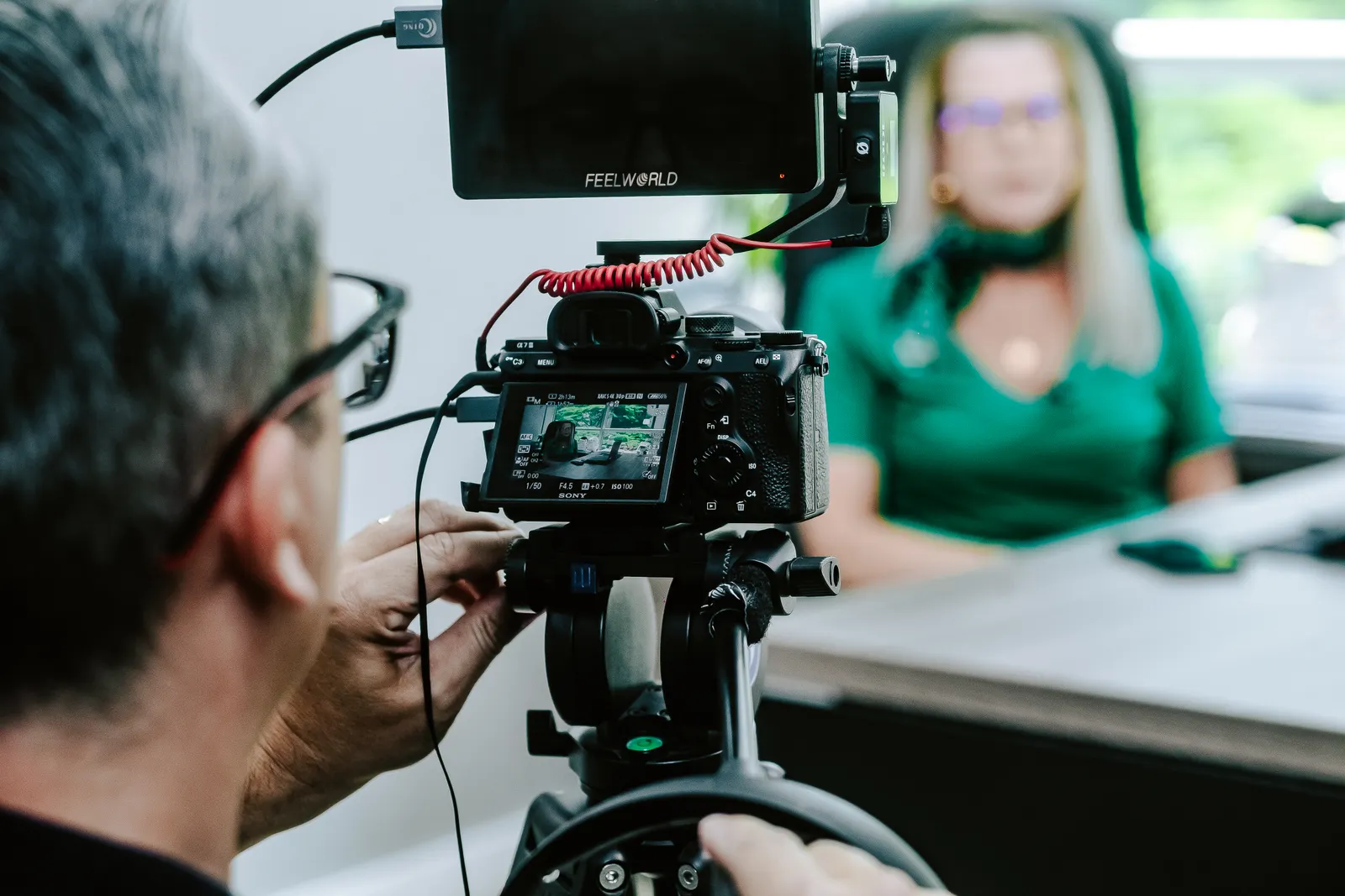 Camera and monitor recording an executive interview