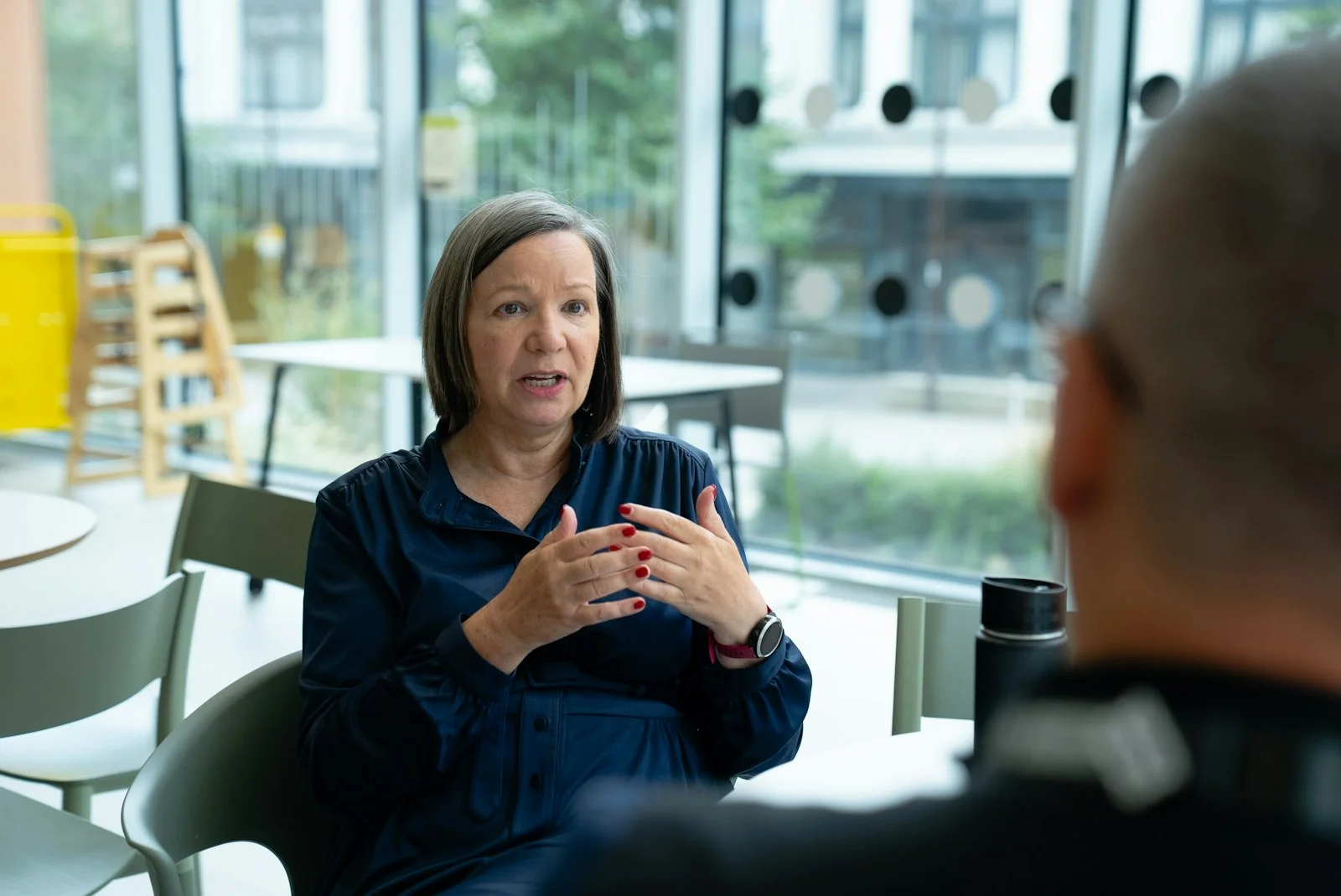 Customer explaining a buying decision during a filmed testimonial interview