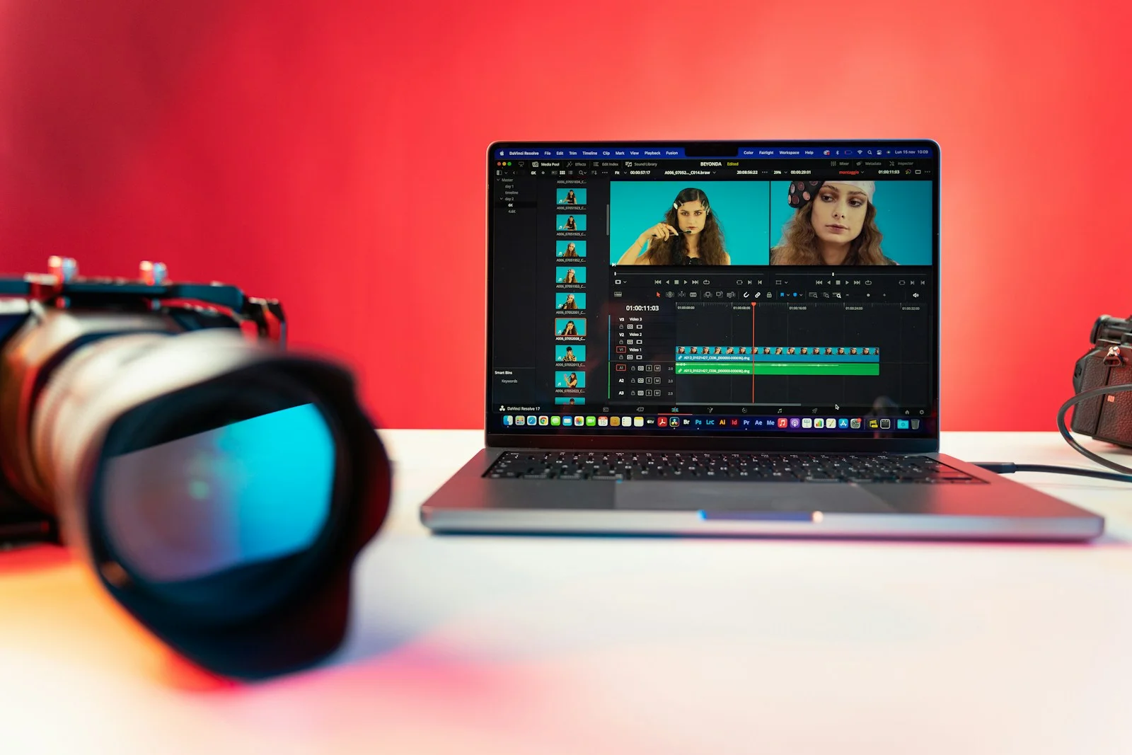 Editor reviewing filmed customer interview footage on a laptop editing timeline